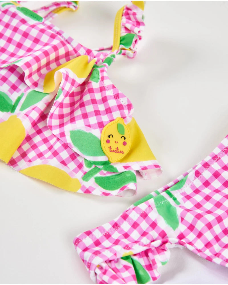 Girl's knitted bikini on a gingham background
