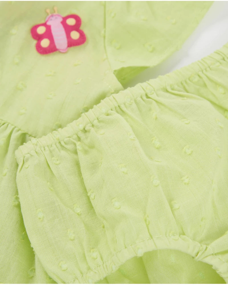 Baby dress in textured polka dot fabric