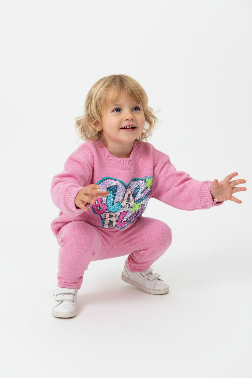 Maglione con pailettes rosa